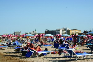 20. sunbathers and beach-lovers enjoying the colourful gaiety of Rimini's shoreline