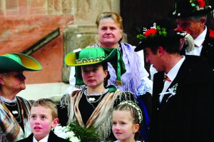 The guest of the peasants wedding gather in front of the church of Castelrotto