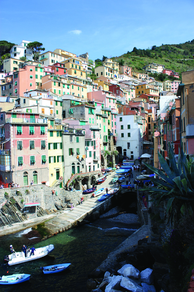 Tourists mingle with the boats on the quay at Riomaggiore