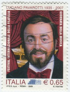 stamp printed in Italy shows Luciano Pavarotti, famous tenor, circa 2009