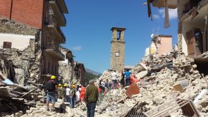 Amatrice - Italy - August 24, 2016: Corso Umberto I's what the morning of the earthquake reduced to an accumulation of debris by rescue workers at work