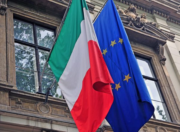 Italian and EU flag on government building