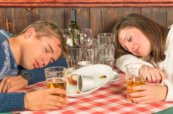 couple experiencing 'abbiocco' after big meal