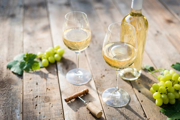 pecorino wine with white wine bottle and grapes