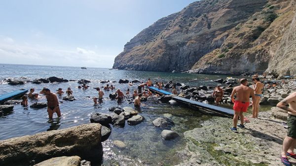 people in Baia di Sorgeto springs in Ischia
