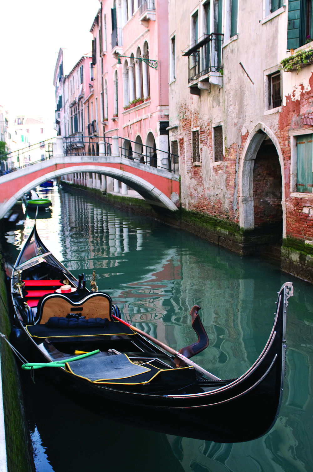 A gondola "parked" along a small canal in Venice