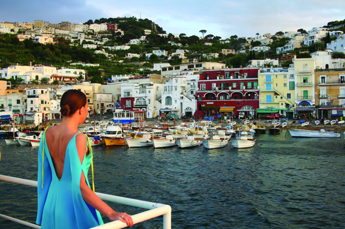 Glamorous partygoer arrives in Capri harbour