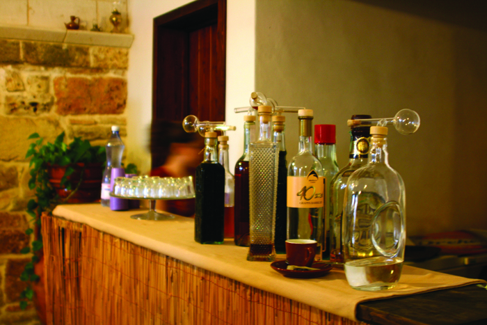 Homemade liquers and grappa in unusual pouring bottles
