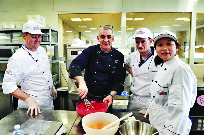 Maestro Luciano Ferrari with some students during a practical lesson at the Carpigiani Gelato University in Anzola nell'Emilia, near Bologna, Italy. Courses range from one to four weeks and most of the time is spent in the lab, making all sorts of gelato.