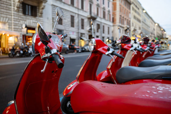 Red Vespa scooters in rome city centre