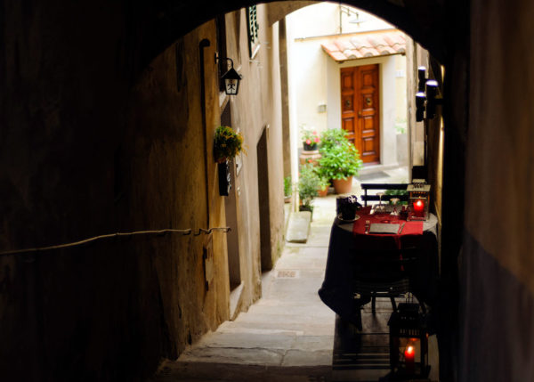 Romantic table for two in the historic centre of Cortona, Tuscany, Italy