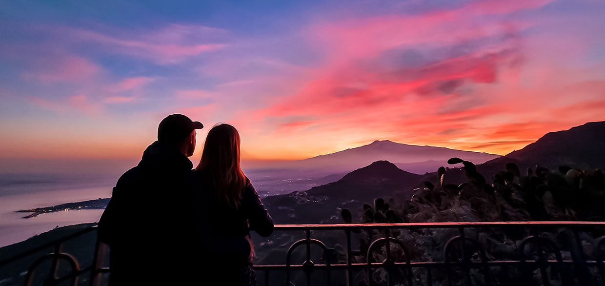 Romantic view of sunset behind Mount Etna, Taormina, Italy