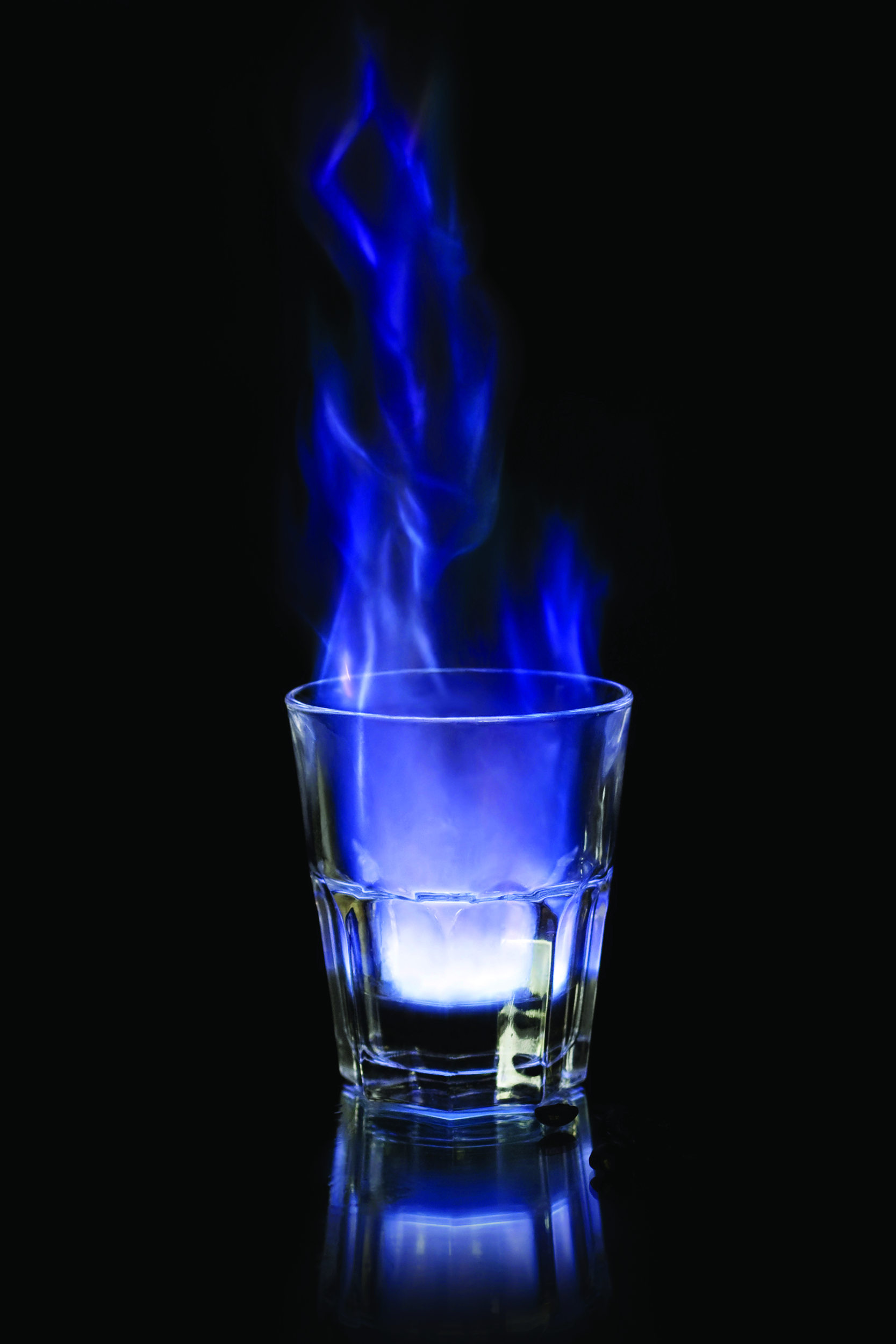 Flaming sambuca over black