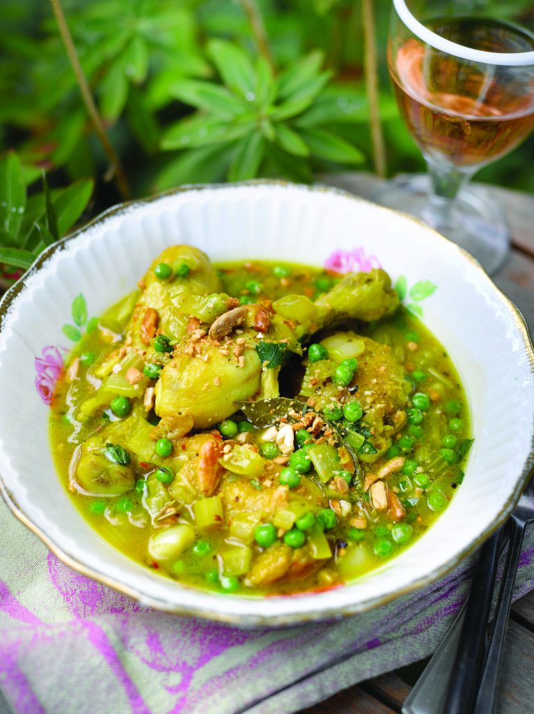Saffronbraised chicken with peas, almonds and garlic