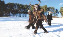 Krampus festival in a snowy field just outside Castelrotto, South Tyrol, Italy