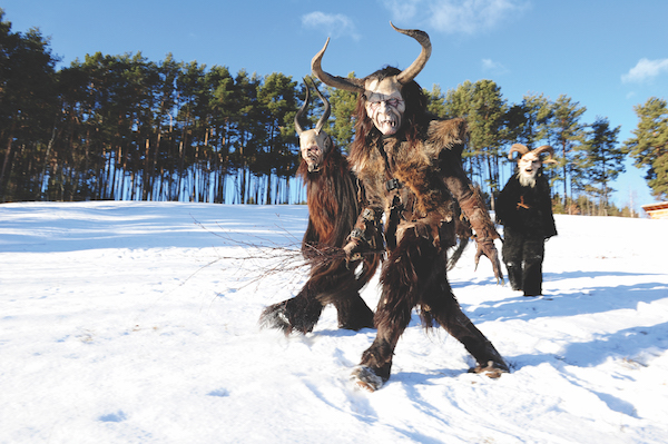 Krampus festival in a snowy field just outside Castelrotto, South Tyrol, Italy