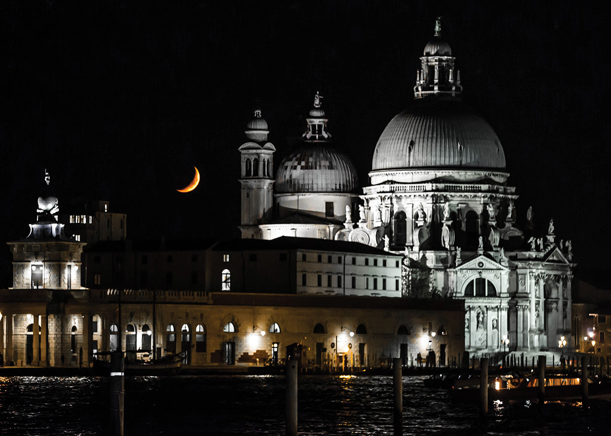 View of Venice looking haunted at night, with spooky crescent moon