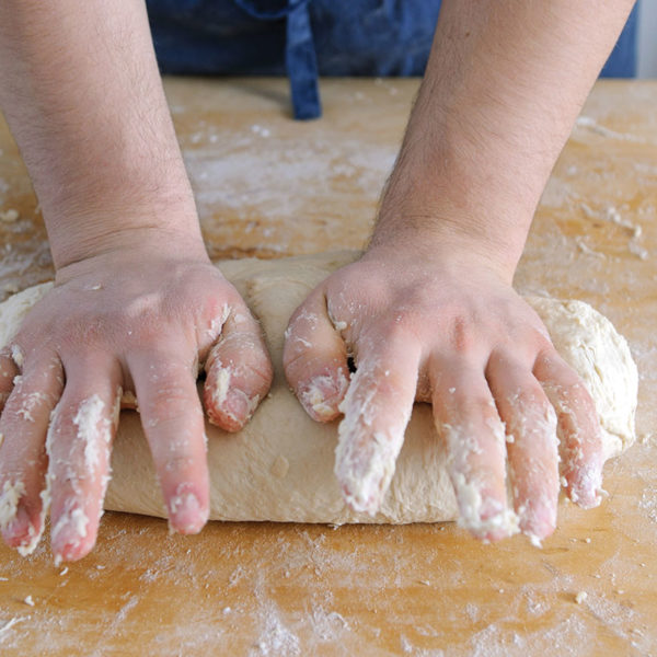 Step 4: kneading the dough by hand before proving
