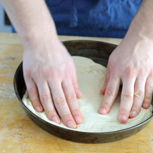 Step 6: stretching the dough into a circular pan
