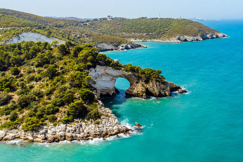 Gargano Promontory national park circular tunnel rock formation at coast