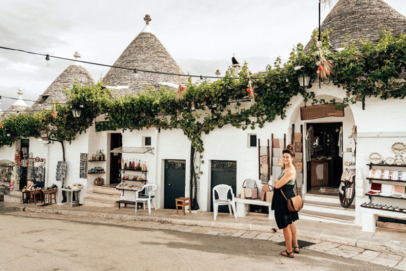 Tourist in alberobello with trulli houses