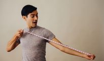 Man measuring his arm