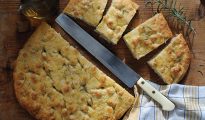 sliced focaccia on wooden table