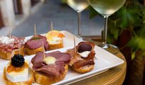 Bite-size snacks with wine glasses