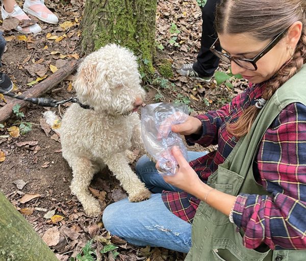 Marta places truffle in a plastic bag while Luna watches