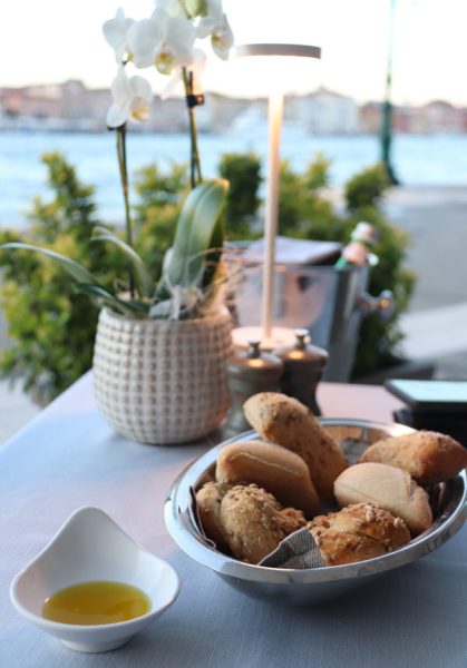 Bread-basket-on-the-table-overlooking-the-canal-at-the-Hilton-Molino-Stucky-Aromi-restaurant