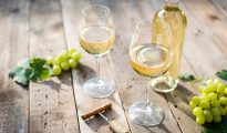 pecorino wine with white wine bottle and grapes