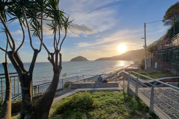 Sun setting over Le Fulmarole beach in Ischia