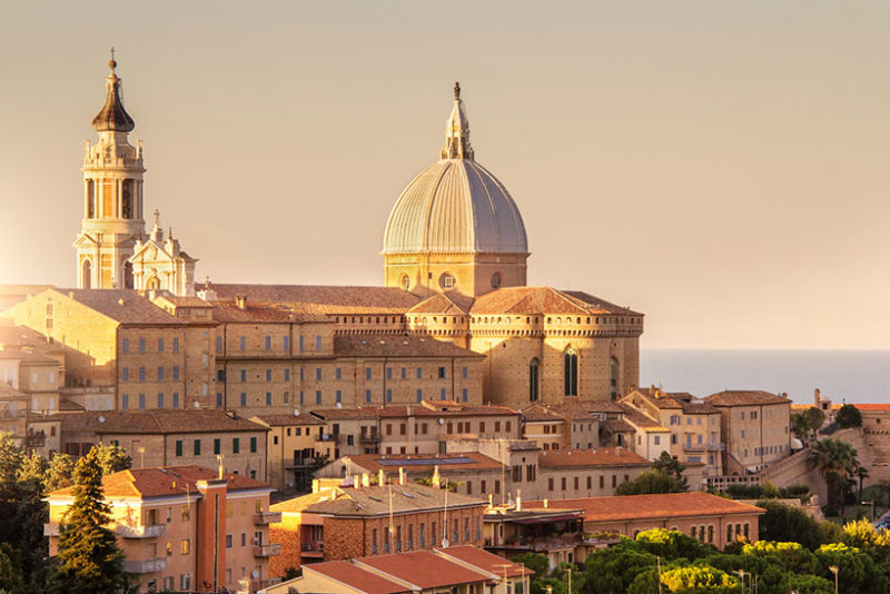 Loreto, Marche, province of Ancona. Panoramic view of the residence of the Basilica della Santa Casa, a popular pilgrimage site for Catholics at sunset