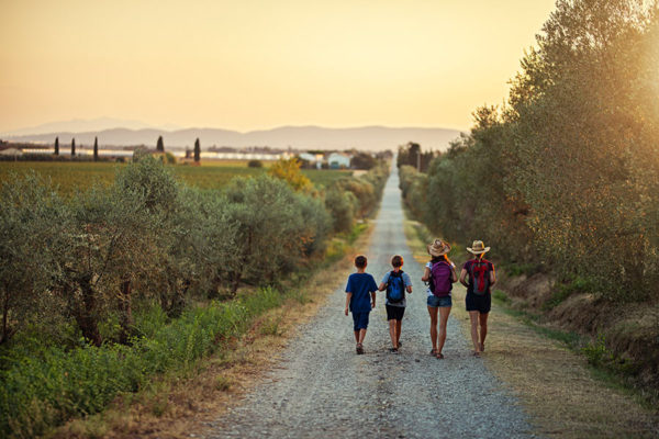 family walking in tuscany
