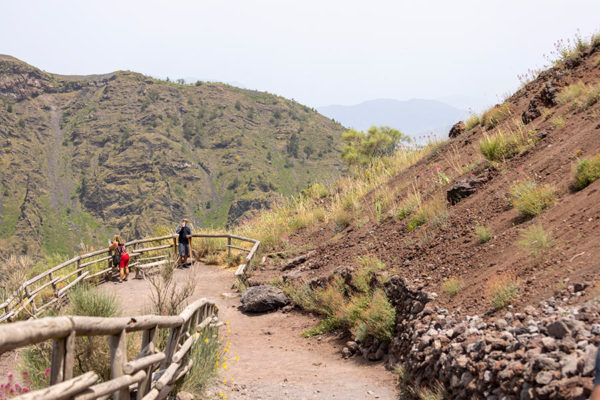 couple walking up mt vesuvius