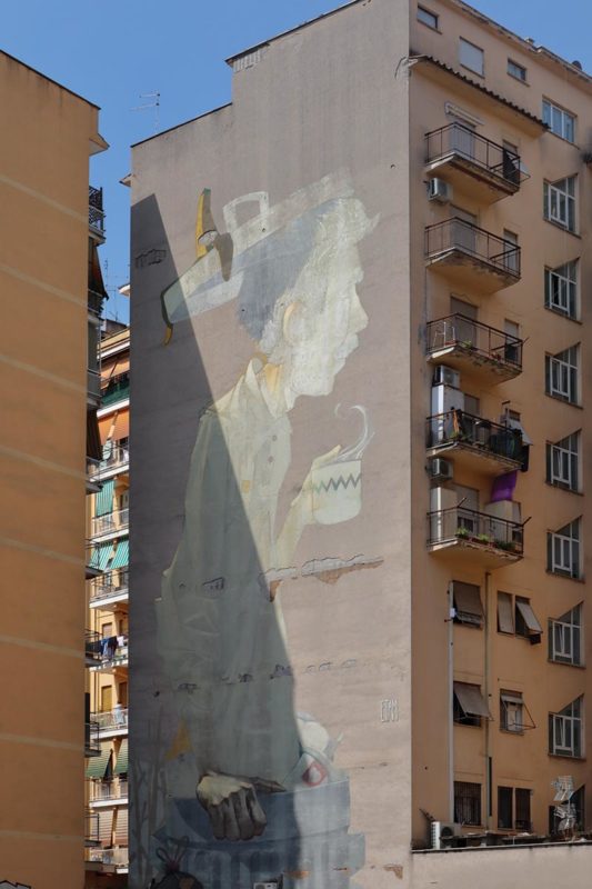 ‘Coffè Break’ mural by Etam Cru – tall street artwork in suburban Rome.