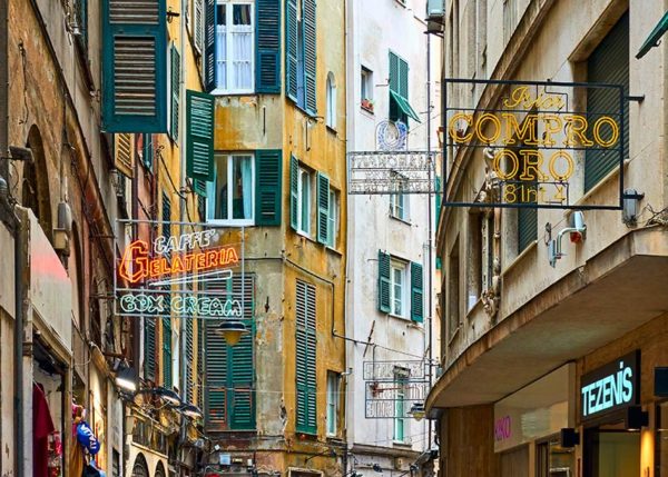 Old street with signboards in Genoa