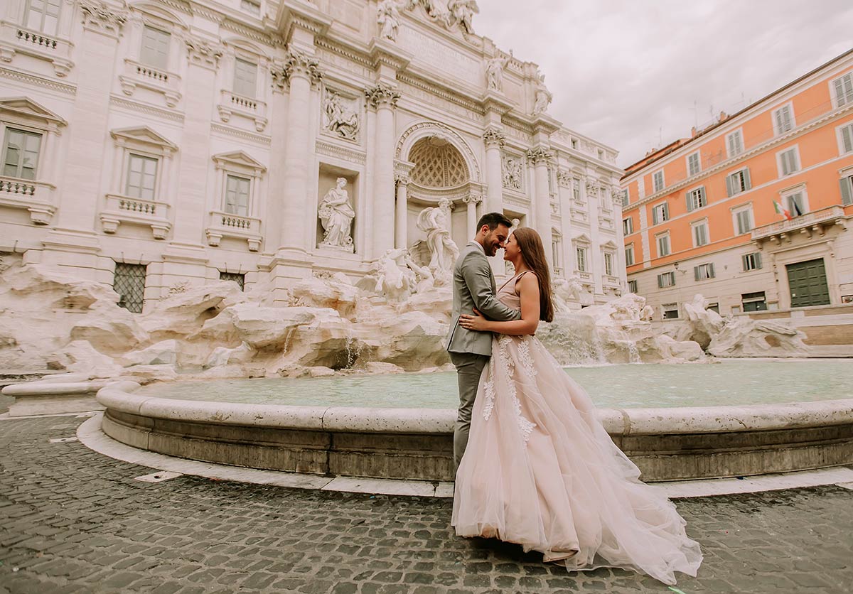 Couple getting married in Italy in front of Rome's Trevi Fountain