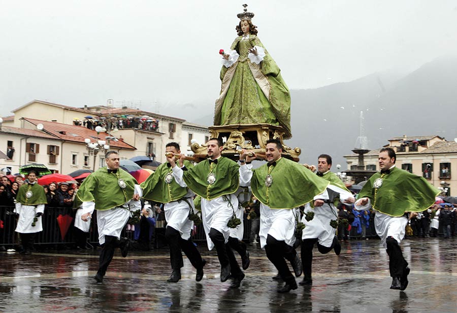 Members of the fraternity of St. Mary of Loreto carry the statue of the Virgin Mary through the streets of Sulmona in Abruzzo during an Easter procession