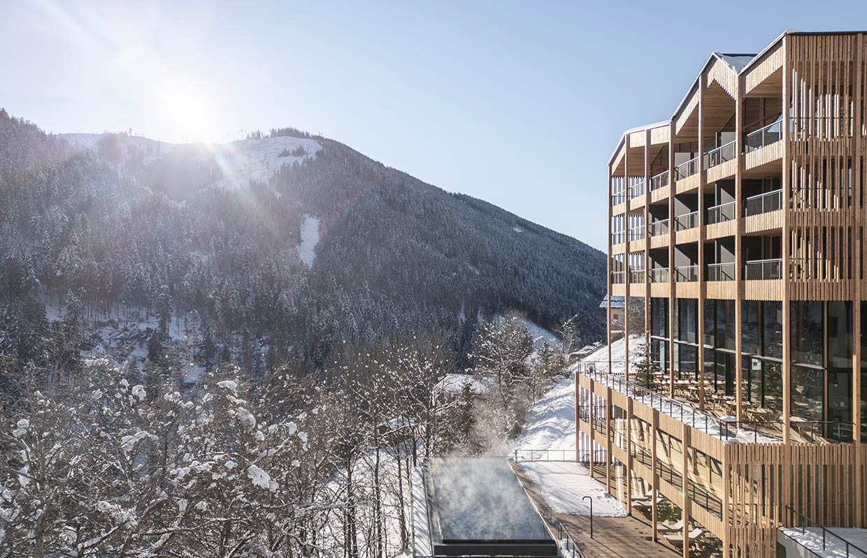 Hotel Engel Ayurpura exterior with outdoor pool and dolomites landscape