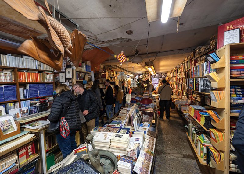 At the Libreria Acqua Alta, books are everywhere – on the tables, in a bathtub, and even inside a gondola