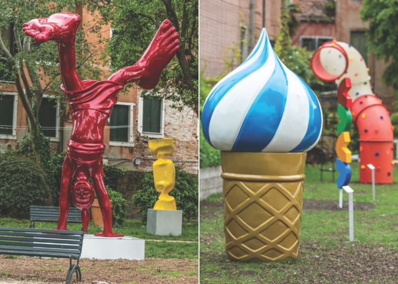 A red handstand statue and a vibrant ice cream cone sculpture in children's parks