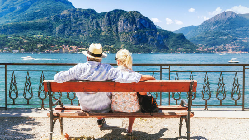 couple relaxing by lake como on slow travel italy