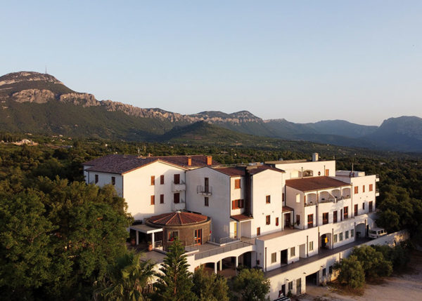 aerial view of hotel amongst mountains
