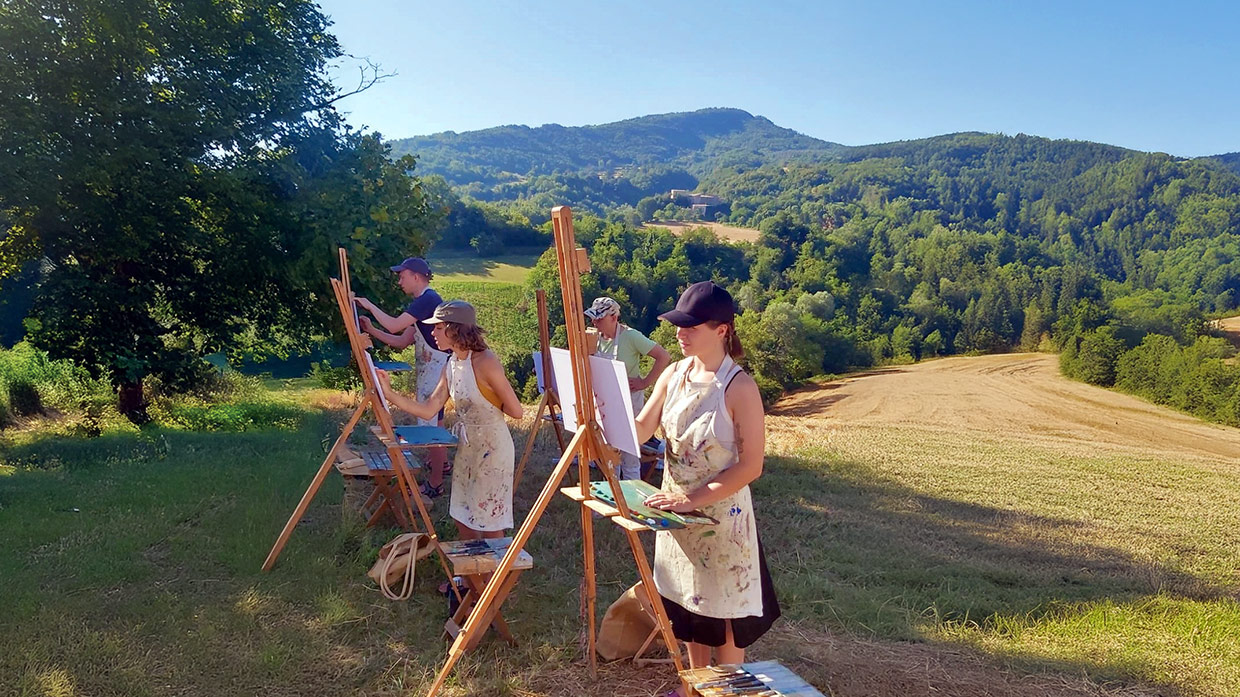 creative holidays italy - painting on hillside