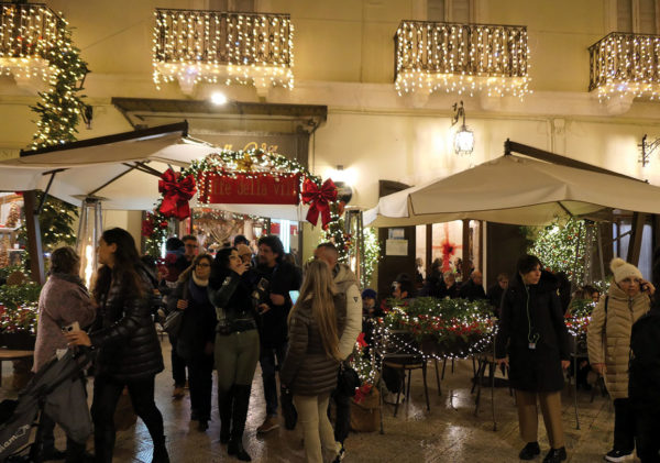 exterior of festive village cafe at night