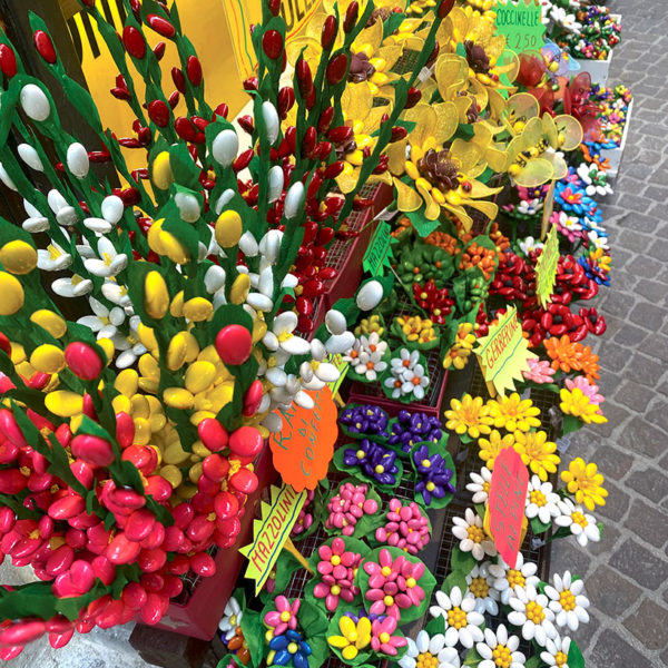 Confetti display - flower bouquets in various colours, plus sugared almond bees and ladybirds