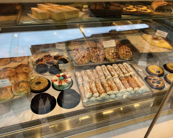 fine bakery items in glass cabinet