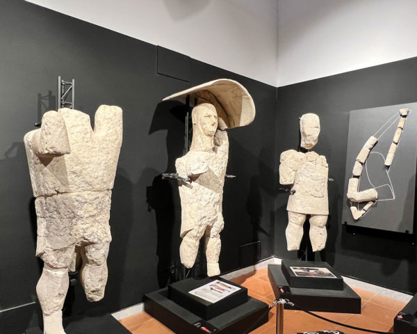 worn stone giants on display at Civic Museum in Cabras