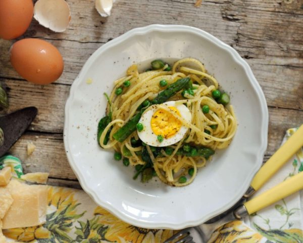 Pasta Primavera spaghetti recipe with half boiled egg on top